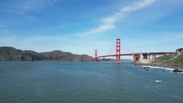 A Bird's eye view of a beautiful beach overlooking the Golden Gate Bridge in San Francisco, California