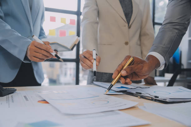 istock Finance manager meeting discussing company growth project success financial statistics, professional investor working start up project for strategy plan with document, laptop and digital tablet. 1906030563