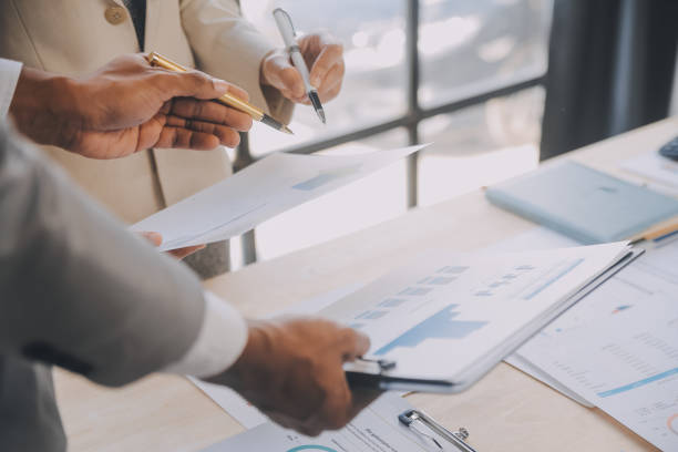istock Finance manager meeting discussing company growth project success financial statistics, professional investor working start up project for strategy plan with document, laptop and digital tablet. 1906030726