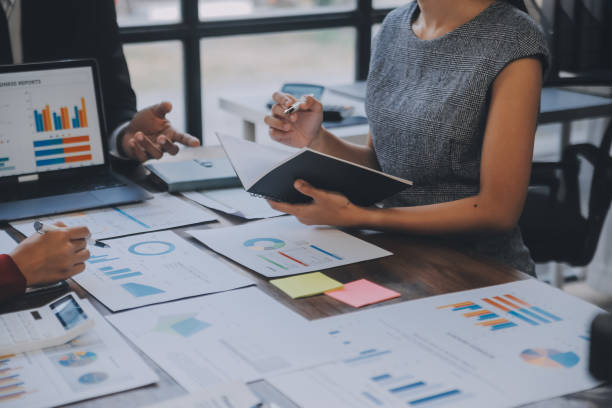 istock Finance manager meeting discussing company growth project success financial statistics, professional investor working start up project for strategy plan with document, laptop and digital tablet. 1906032670