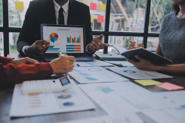 istock Finance manager meeting discussing company growth project success financial statistics, professional investor working start up project for strategy plan with document, laptop and digital tablet. 1906032673