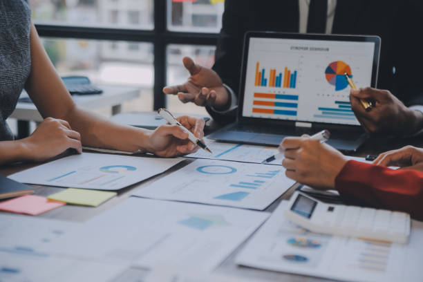 istock Finance manager meeting discussing company growth project success financial statistics, professional investor working start up project for strategy plan with document, laptop and digital tablet. 1906032674