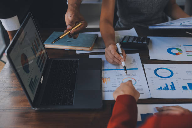 istock Finance manager meeting discussing company growth project success financial statistics, professional investor working start up project for strategy plan with document, laptop and digital tablet. 1906034732