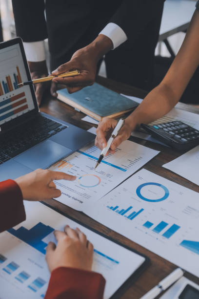 istock Finance manager meeting discussing company growth project success financial statistics, professional investor working start up project for strategy plan with document, laptop and digital tablet. 1906034740