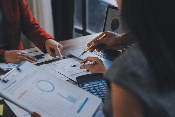 istock Finance manager meeting discussing company growth project success financial statistics, professional investor working start up project for strategy plan with document, laptop and digital tablet. 1906034741