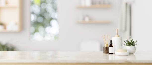 istock Toiletries and copy space on a luxury white tabletop with a blurred background of a modern bathroom. 1906068482
