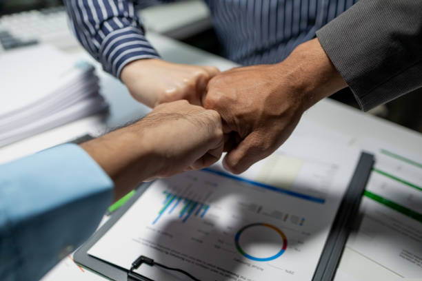 istock Group with hands together, teamwork, collaboration and unity between business people with their hands stacked for project development and innovation, group of corporate colleagues united, 1906093637