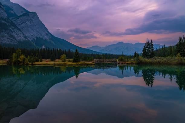 istock Reflections In A Banff Lake At Sunrise 1906131095