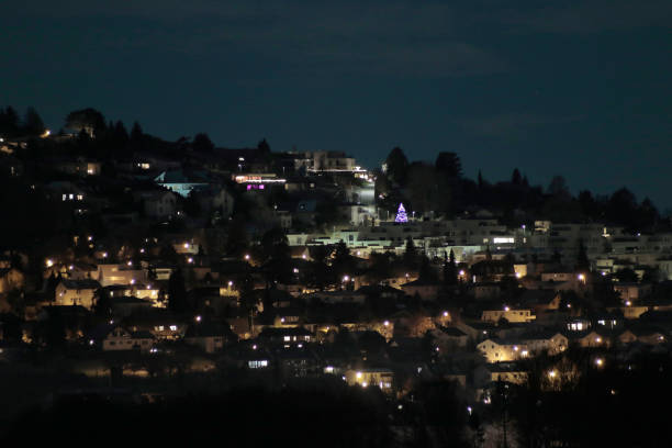 istock Town On A Hill Slope At Night 1906136808
