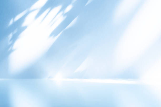 istock Wall interior background, studio, and backdrops show products. with shadow from window color white and blue light. background for text insertion and presentation of product 1906152874