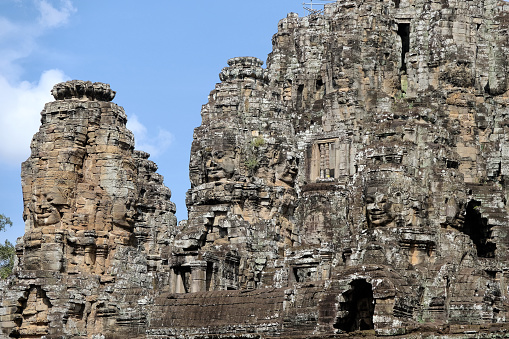 Traveler exploring the ancient ruins of Ta Prohm temple at Angkor, Siem Reap, Cambodia.