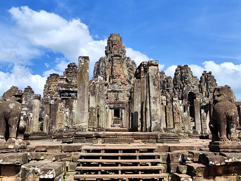 Facade of ancient temple complex Angkor Wat in Siem Reap, Cambodia. Angkor Wat is a popular tourist attraction.