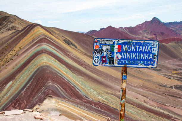istock Road sign in Vinicunca Rainbow mountain, CUsco, Peru 1906184117