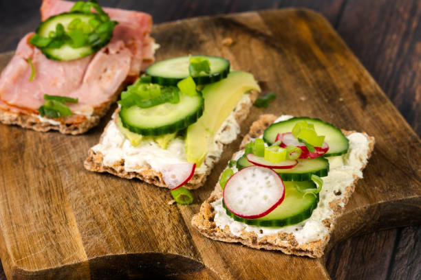 istock Rye crisp bread with cucumber, avocado, ham 1906310693