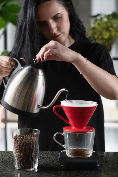 istock Female Barista's Drip Coffee Mastery 1906409354