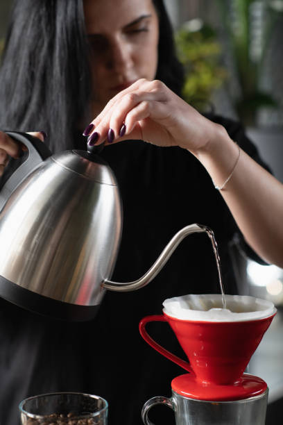 istock Female Barista's Drip Coffee Mastery 1906409355