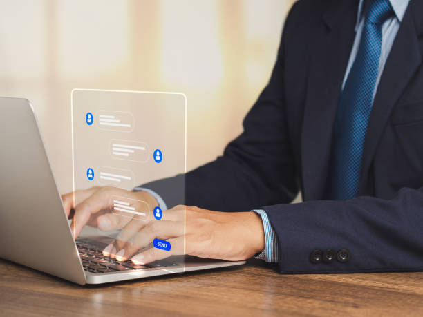 istock Businessman typing on a keyboard laptop with live chat chatting on application communication digital media websites and social network 1906428772