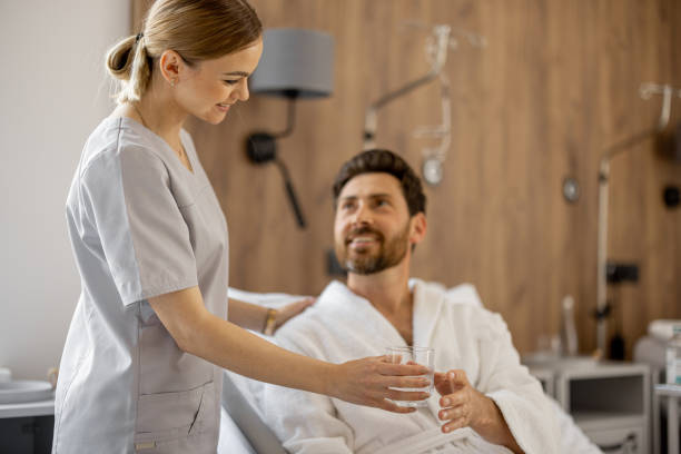 istock Nurse and patient in medical ward 1906482111