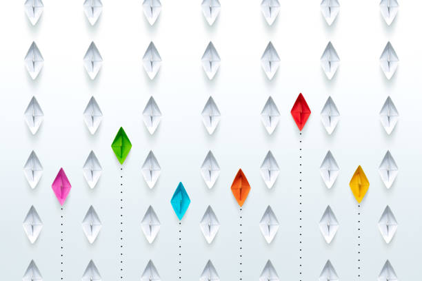 istock Group of paper ships in one direction and with one group individual pointing in the different way. New idea, different vision creative, Unique way and Business for innovative solution concept. 1906490903
