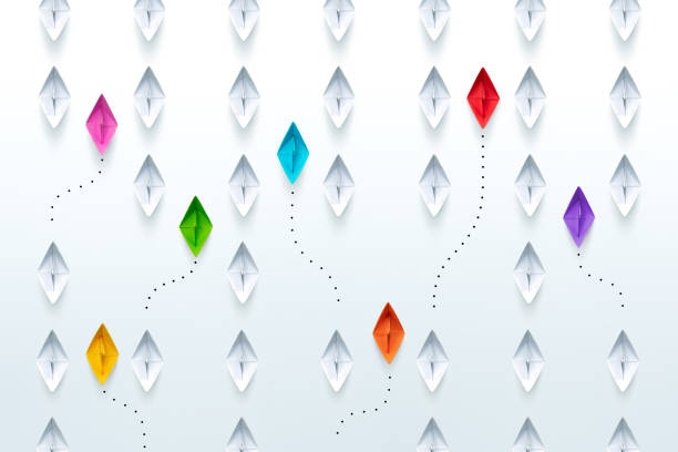 Group of paper ships in one direction and with one group individual pointing in the different way. New idea, different vision creative, Unique way and Business for innovative solution concept.