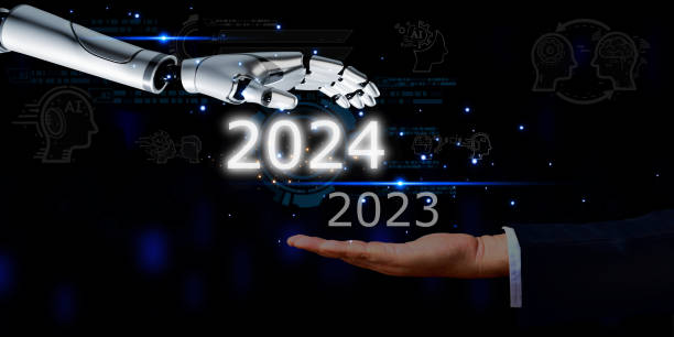 istock 2024 business revolution Companies using AI technology Come help upgrade employees, plan your business, and create protection against cyber attacks. business hand with robotic hand text 2024 element digital icon , technology concept 1906490912