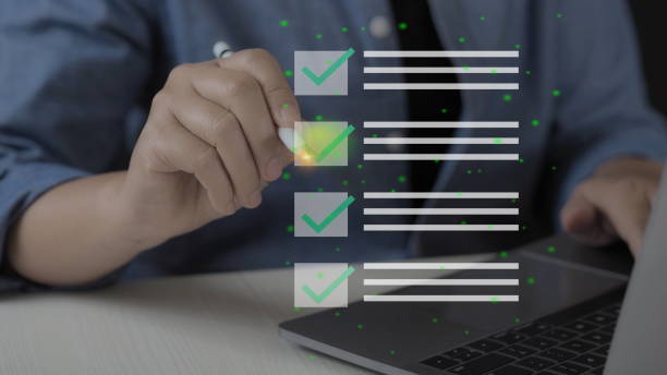 Business performance checklist, businessman using laptop doing online checklist survey, filling out digital form checklist, take an assessment, questionnaire, evaluation, online survey, online exam.