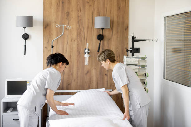 istock Maids make the bed in medical ward 1906495546