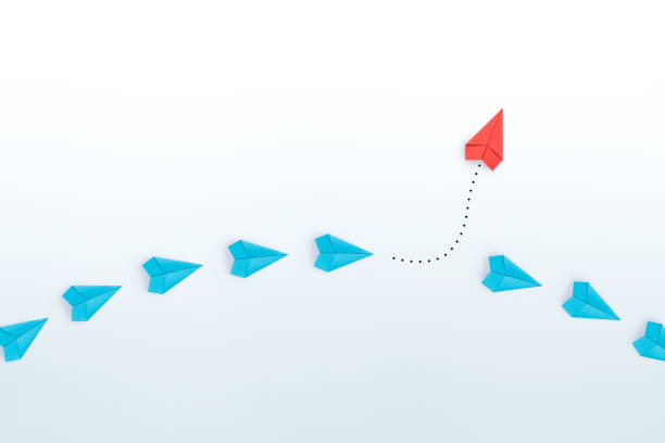 istock Business for new ideas creativity, innovative and solution concepts. Group of blue paper plane in one direction and one red paper plane pointing in different way on white background. copy space 1906496077