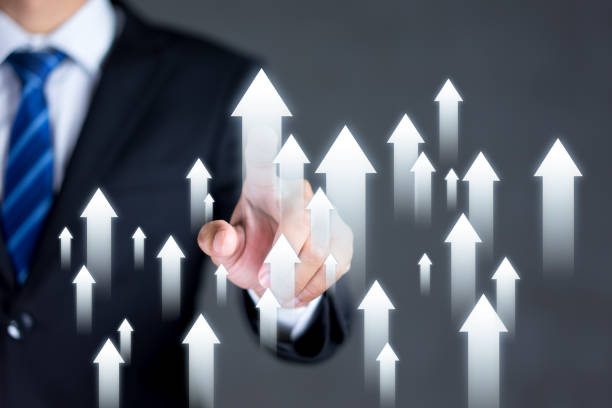 istock Businessman touching the arrow pointing up. Development, Competition, Growth and successful of business concepts. 1906496591