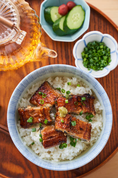 istock Japanese food : broiled eel on rice with green tea poured on top 1906506966