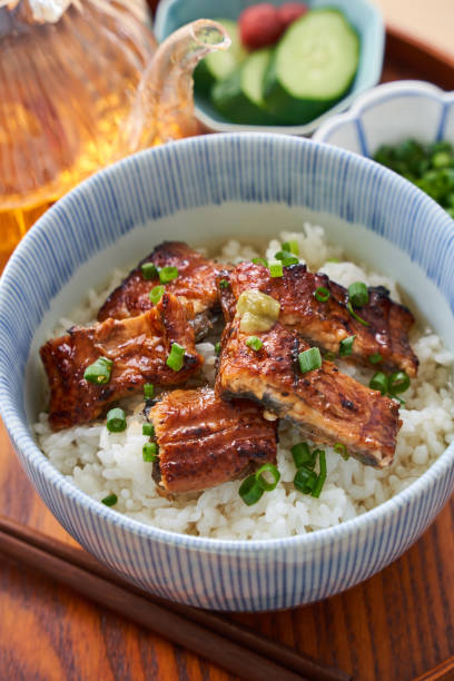 istock Japanese food : broiled eel on rice with green tea poured on top 1906507485