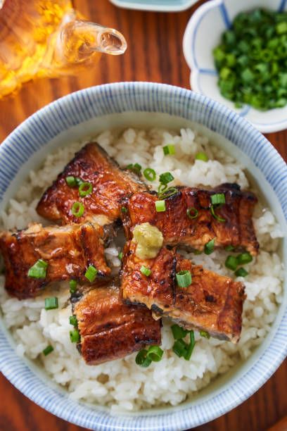 istock Japanese food : broiled eel on rice with green tea poured on top 1906508002