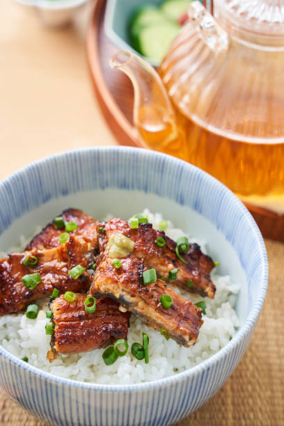 istock Japanese food : broiled eel on rice with green tea poured on top 1906508520