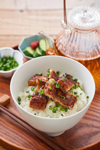 istock Japanese food : broiled eel on rice with green tea poured on top 1906508526