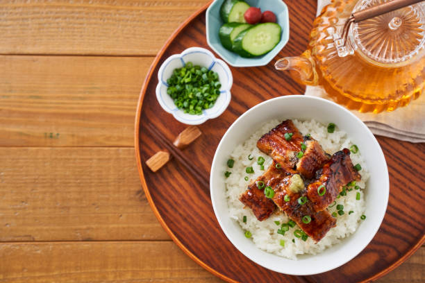 istock Japanese food : broiled eel on rice with green tea poured on top 1906508531