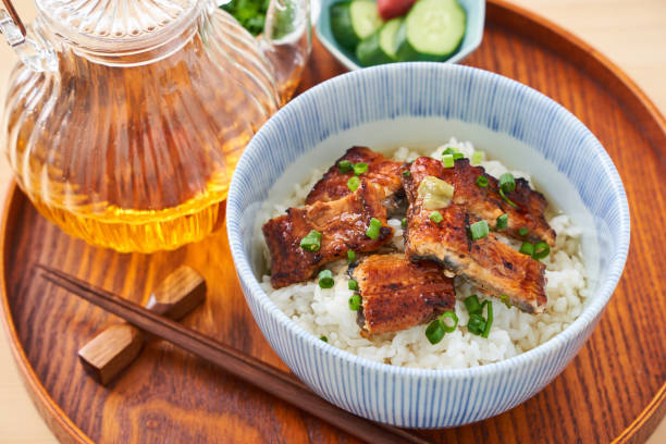 istock Japanese food : broiled eel on rice with green tea poured on top 1906508544