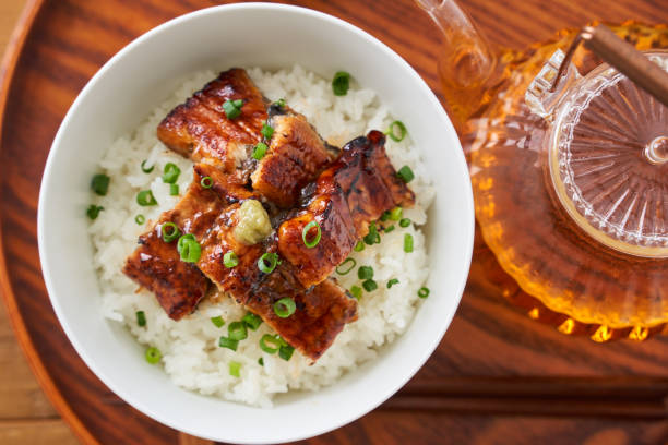 istock Japanese food : broiled eel on rice with green tea poured on top 1906509071