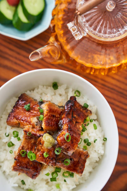istock Japanese food : broiled eel on rice with green tea poured on top 1906509574