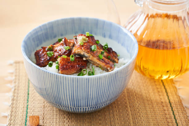 istock Japanese food : broiled eel on rice with green tea poured on top 1906509584