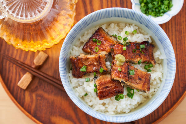 istock Japanese food : broiled eel on rice with green tea poured on top 1906509588