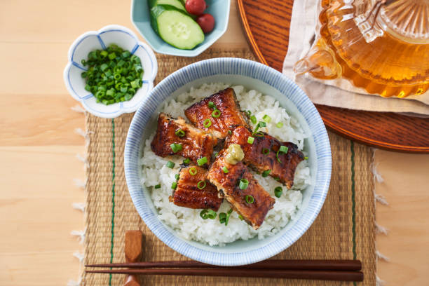 istock Japanese food : broiled eel on rice with green tea poured on top 1906510102