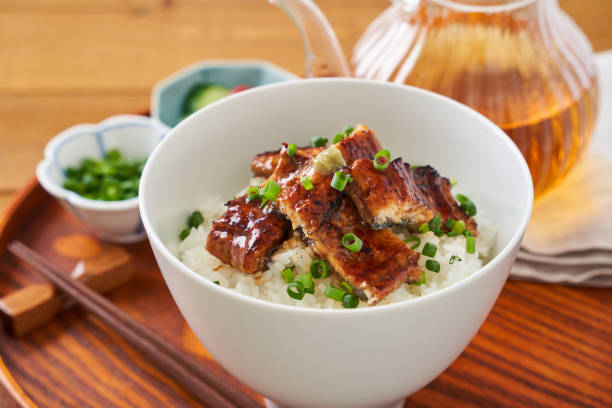 istock Japanese food : broiled eel on rice with green tea poured on top 1906510103