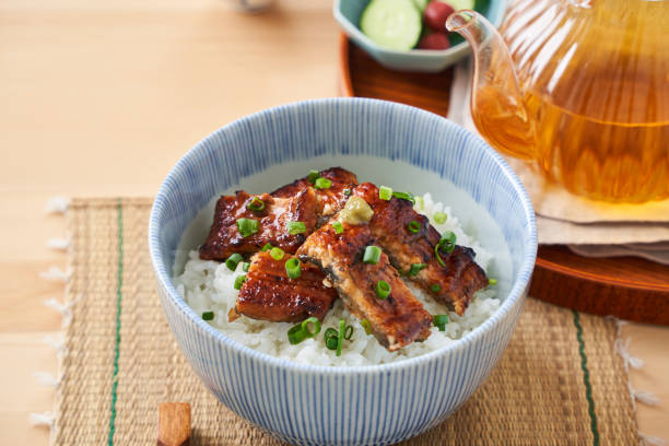istock Japanese food : broiled eel on rice with green tea poured on top 1906510612