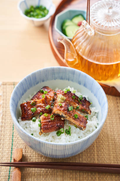 istock Japanese food : broiled eel on rice with green tea poured on top 1906510618