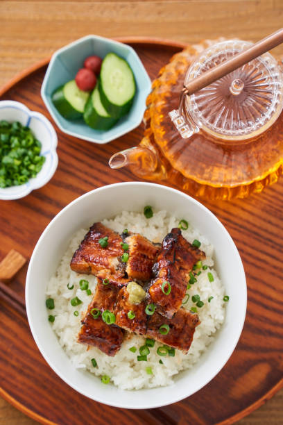 istock Japanese food : broiled eel on rice with green tea poured on top 1906511001
