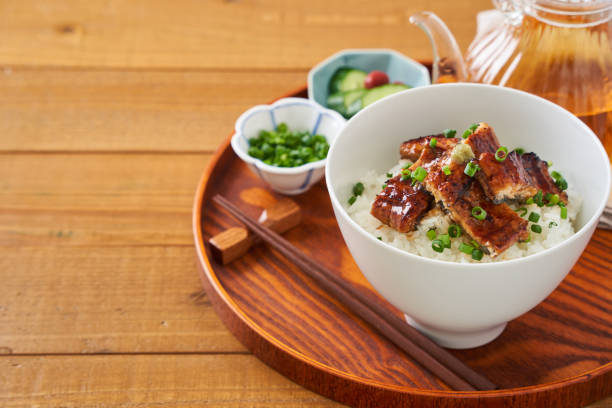 istock Japanese food : broiled eel on rice with green tea poured on top 1906511128