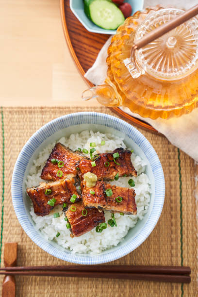 istock Japanese food : broiled eel on rice with green tea poured on top 1906511130