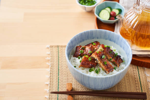 istock Japanese food : broiled eel on rice with green tea poured on top 1906511135