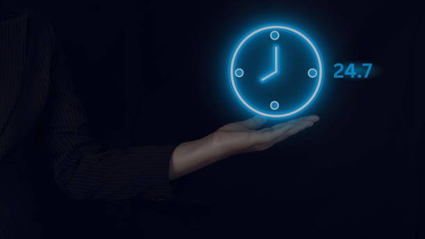 istock Customer service, businessman hands holding virtual 24 - 7 with clock in hand for non-stop and full-time global contact, non-stop service concept. 1906519423