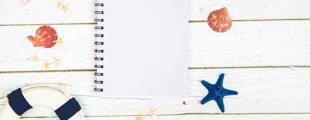 istock Flat lay composition with beach accessories on wooden background. Space for text 1906543775